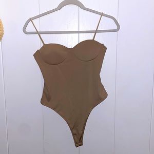 Tic Tox strap bodysuit. Size small.